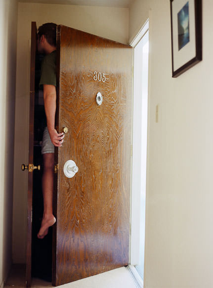Photographs of People Crammed into Uncomfortable Spaces 