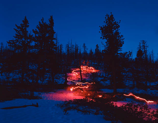 Cold and Dark Landscapes Illuminated by the Red Glow of Emergency Flares takerefuge 8